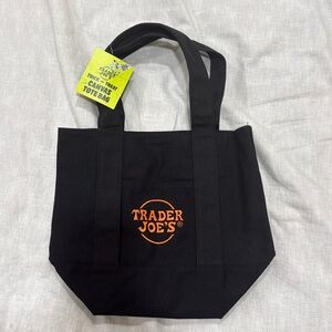 Trader Joe’s Trick or treat canvas tote bag in black and orange letters